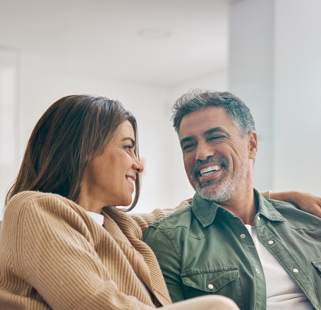 Smiling couple sitting close together