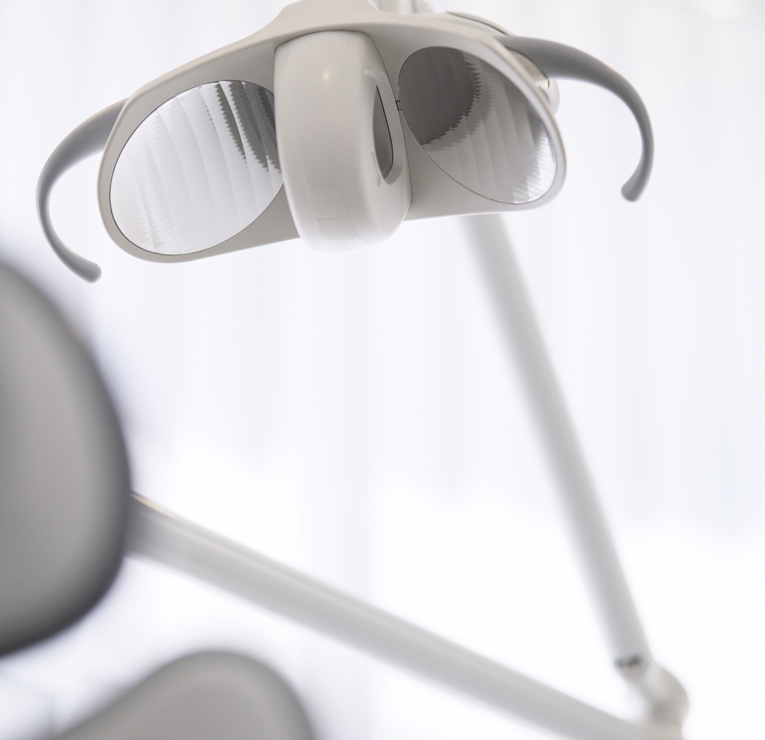 Dental overhead light in treatment room.